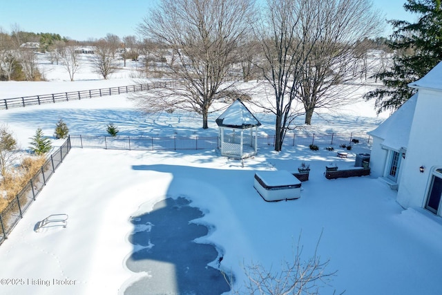 view of yard layered in snow