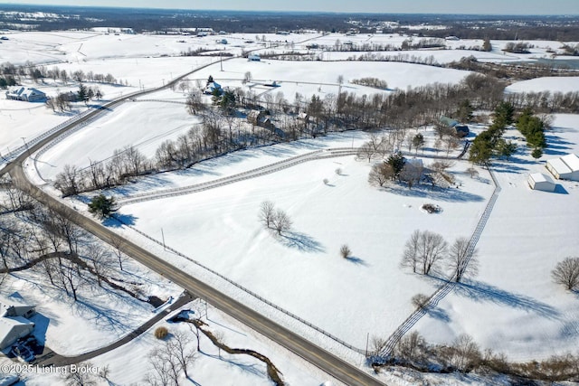 snowy aerial view featuring a rural view