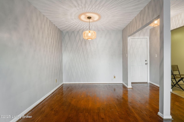 unfurnished room featuring dark hardwood / wood-style flooring