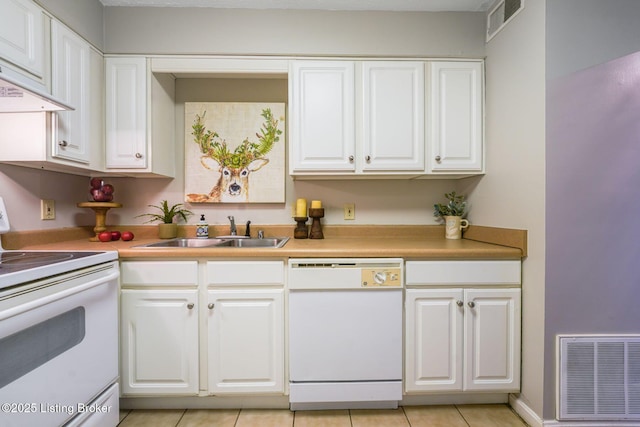 kitchen with white cabinetry, white appliances, and sink