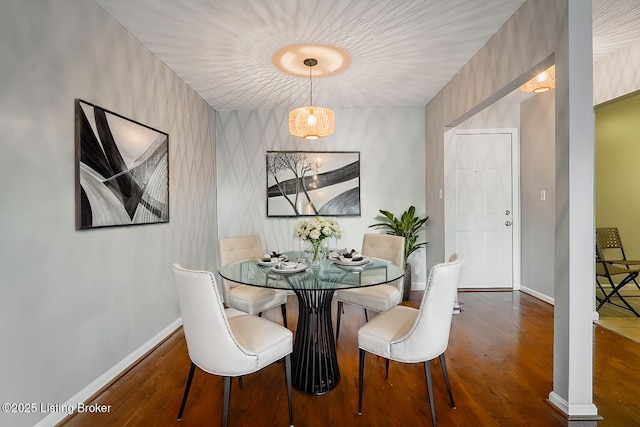 dining space with dark hardwood / wood-style floors