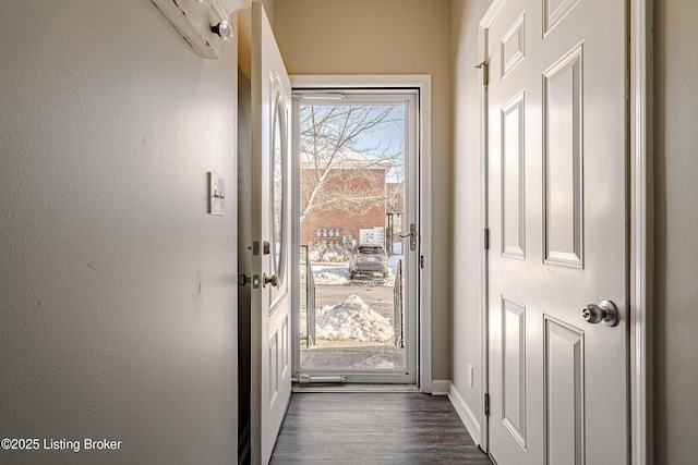 doorway to outside featuring dark hardwood / wood-style floors