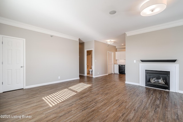 unfurnished living room featuring ornamental molding and dark wood-type flooring