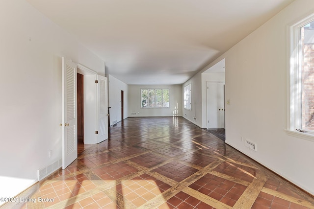 empty room featuring tile patterned floors