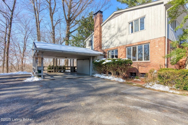 view of home's exterior featuring a carport