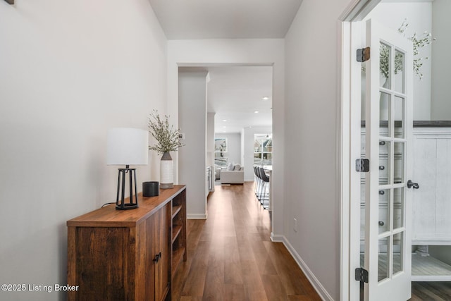 hall with dark wood-type flooring