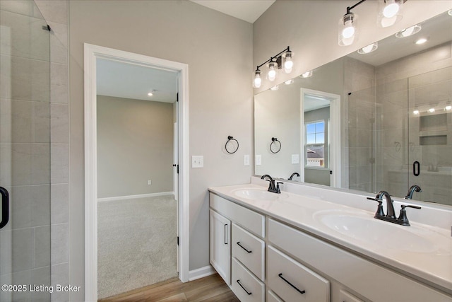 194 Harvest Point Way Unit 202B, Mt Washington, KY 40047 - bathroom featuring double vanity, a stall shower, and wood finished floors
