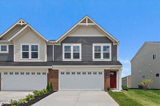 194 Harvest Point Way Unit 202B, Mt Washington, KY 40047 - view of front facade with driveway, brick siding, and a garage