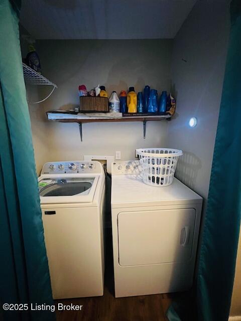 laundry area with hardwood / wood-style floors and independent washer and dryer