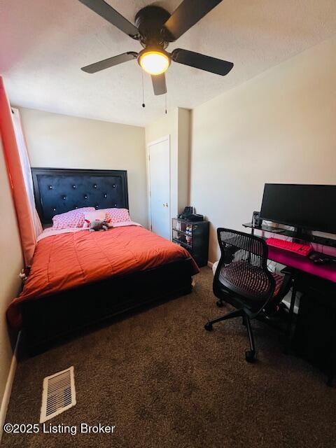 bedroom with ceiling fan and carpet