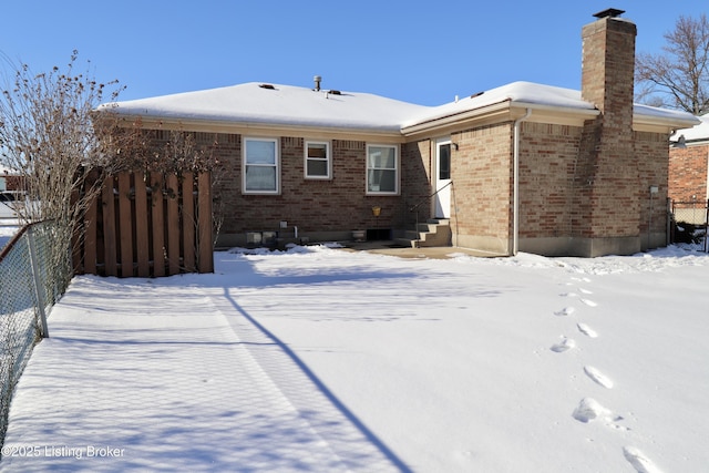 view of snow covered house