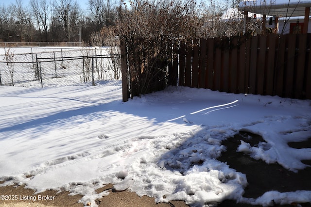 view of yard layered in snow