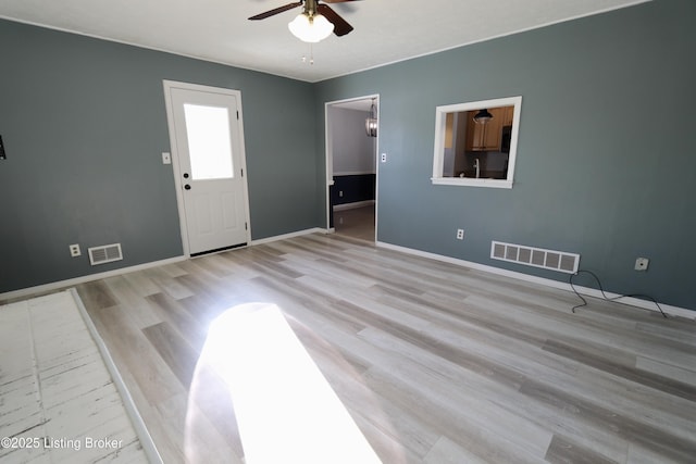 interior space featuring ceiling fan and light hardwood / wood-style flooring