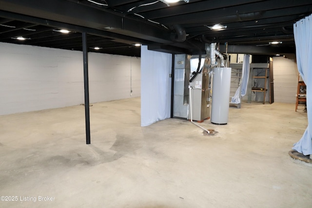 basement featuring heating unit and water heater