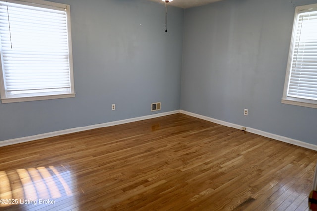 empty room featuring hardwood / wood-style flooring