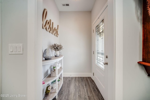 doorway to outside featuring wood-type flooring