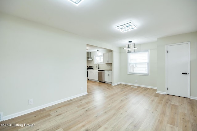 interior space with sink and light wood-type flooring