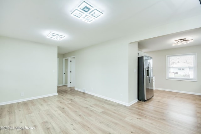 empty room with light wood-type flooring