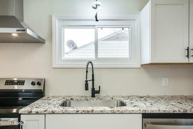 kitchen featuring white cabinetry, sink, wall chimney exhaust hood, and stainless steel appliances