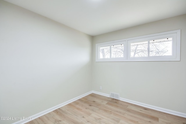 unfurnished room featuring light hardwood / wood-style flooring