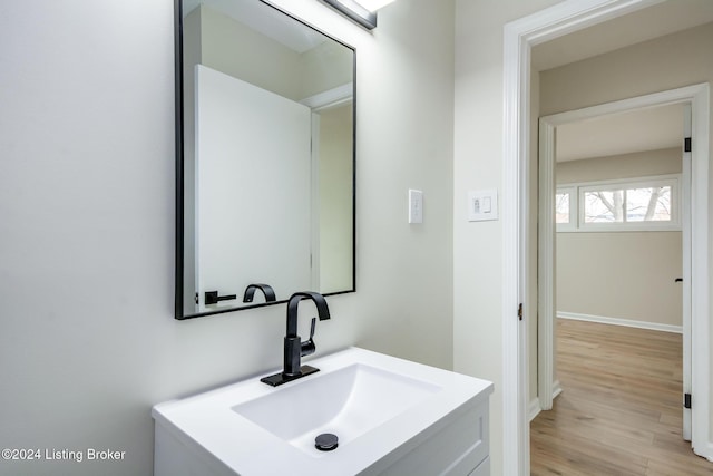 bathroom featuring wood-type flooring and vanity