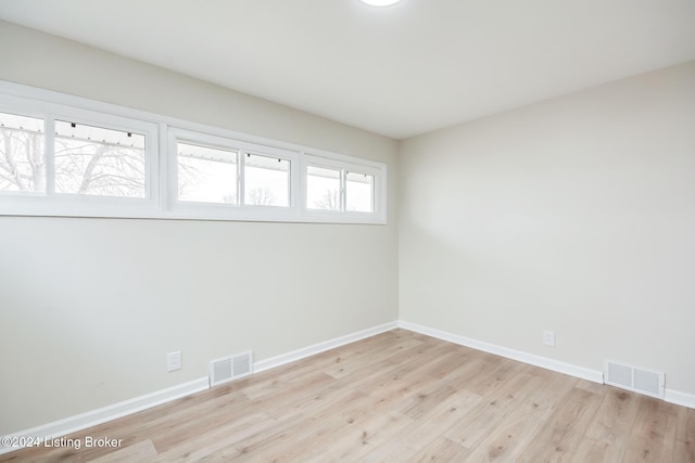 unfurnished room featuring light hardwood / wood-style floors