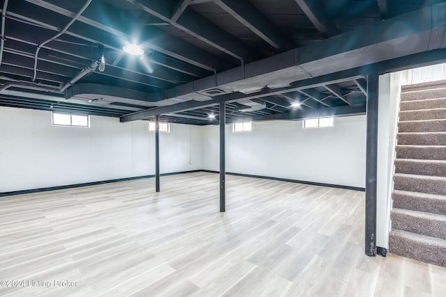 basement featuring hardwood / wood-style floors