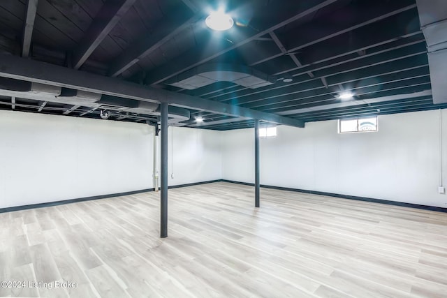 basement featuring hardwood / wood-style floors