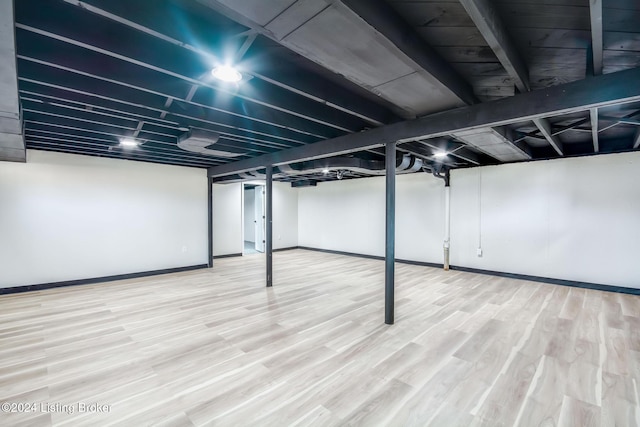 basement featuring hardwood / wood-style floors