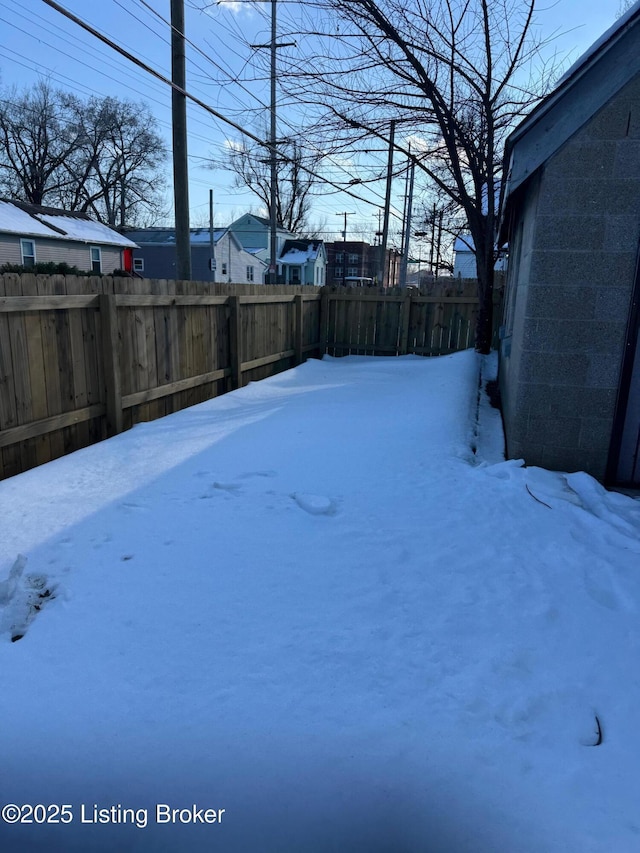 view of yard covered in snow