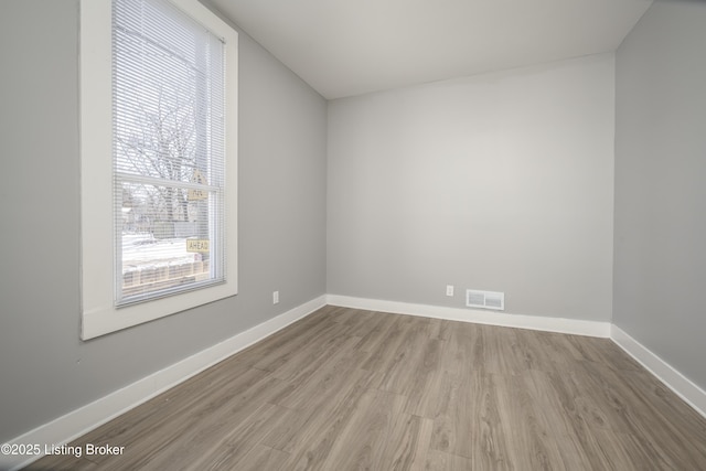 unfurnished room featuring light wood-type flooring