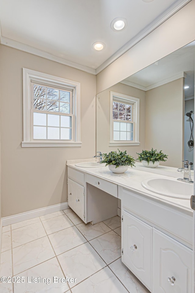 bathroom featuring crown molding and vanity