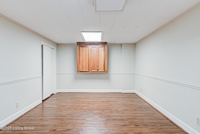 empty room with hardwood / wood-style flooring