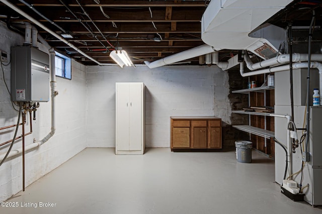 basement featuring water heater and heating unit