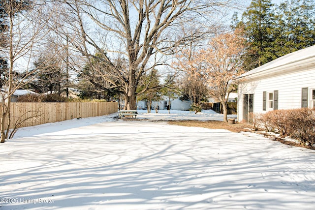 view of yard covered in snow