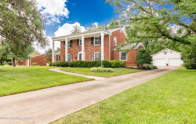 greek revival inspired property with a garage, brick siding, an outdoor structure, and a front lawn