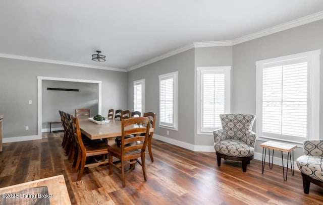 dining space featuring crown molding and dark wood-type flooring