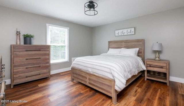 bedroom featuring dark hardwood / wood-style floors