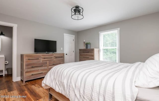 bedroom featuring dark hardwood / wood-style flooring