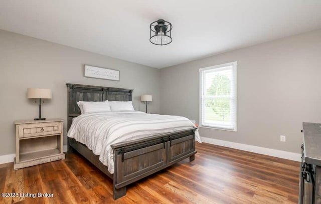 bedroom featuring dark hardwood / wood-style floors