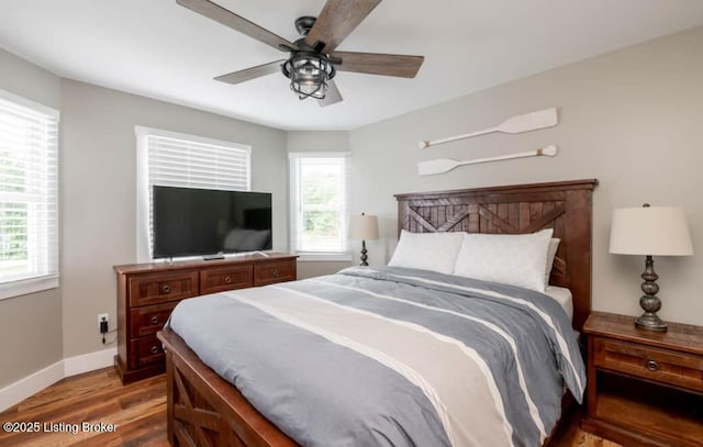 bedroom featuring hardwood / wood-style floors and ceiling fan