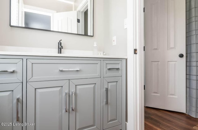 bathroom featuring hardwood / wood-style floors and vanity