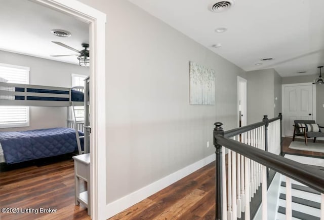 hallway featuring dark hardwood / wood-style floors