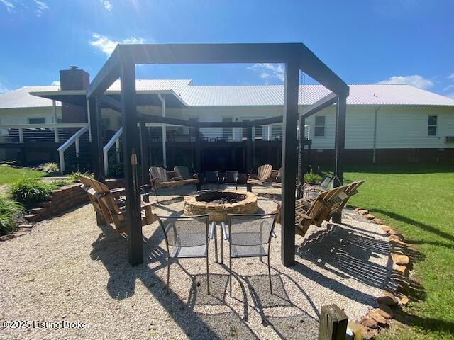 view of patio featuring an outdoor fire pit