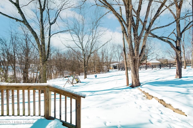 view of yard layered in snow