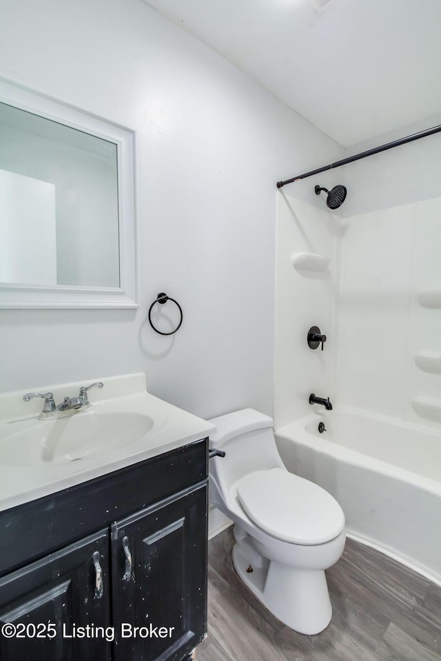 full bathroom with toilet, bathtub / shower combination, wood-type flooring, and vanity