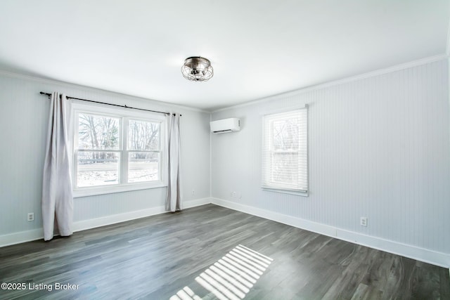 unfurnished room featuring ornamental molding, a wall mounted air conditioner, a wealth of natural light, and dark hardwood / wood-style floors