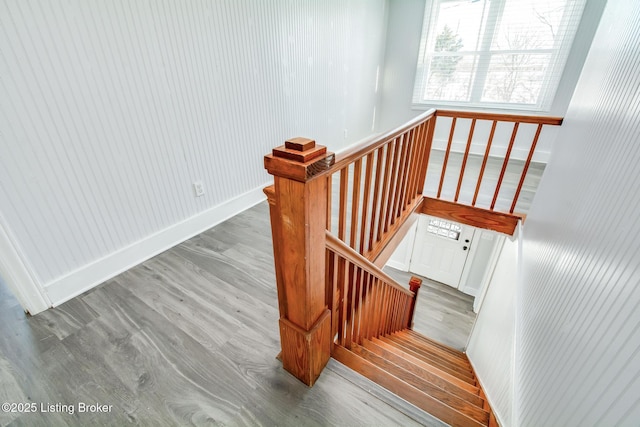 staircase featuring wood-type flooring