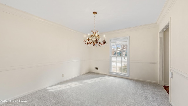 carpeted empty room with crown molding and an inviting chandelier