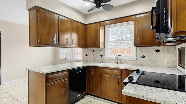 kitchen with sink, light tile patterned floors, kitchen peninsula, ceiling fan, and black appliances